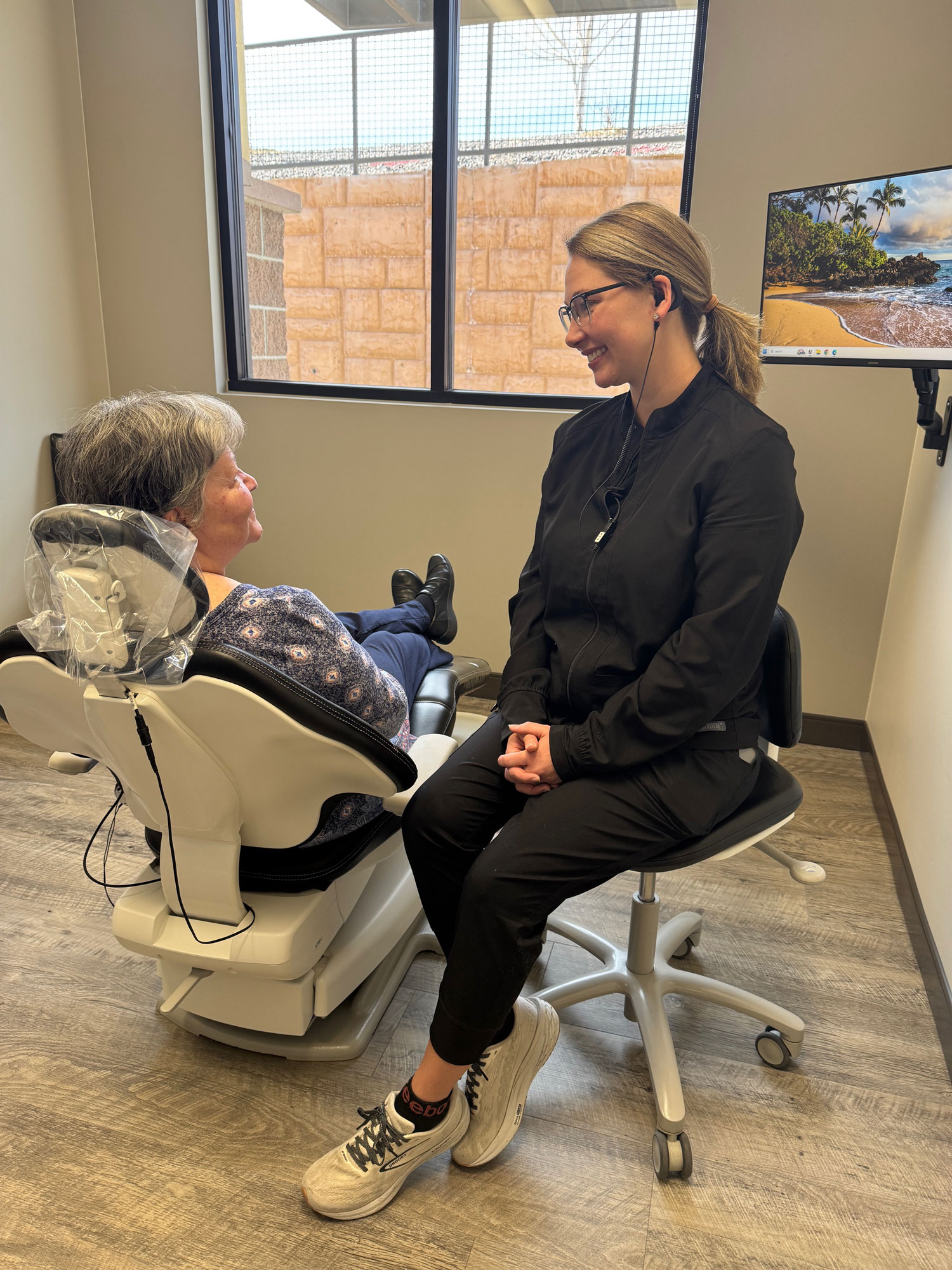Dental hygienist consulting with patient at Prairie Hawk Dental in Castle Rock, CO